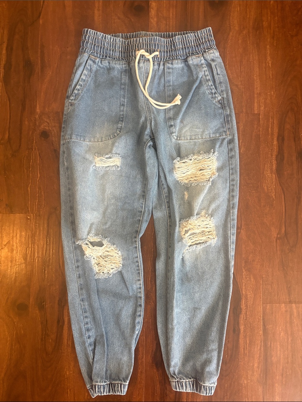 Women’s Celebrity Pink Distressed Jogger Jeans